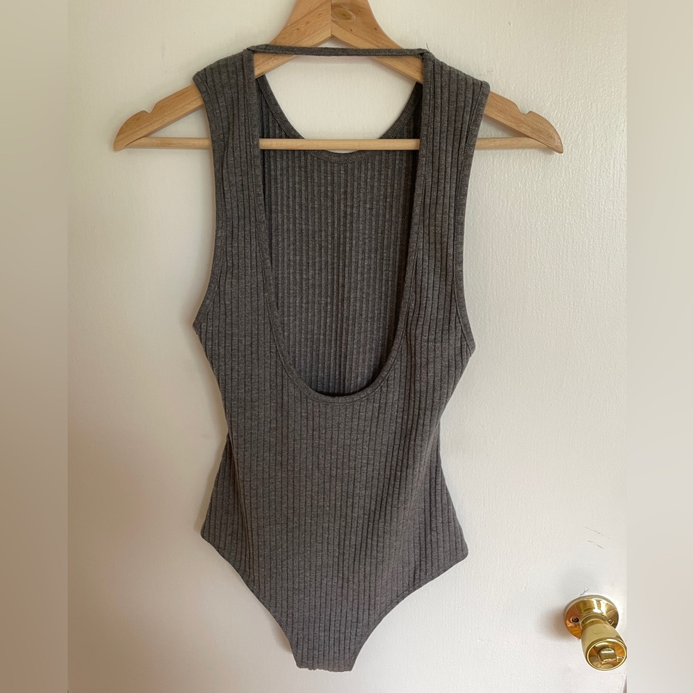 Stolen Hearts Gray Bodysuit with snaps and low back. Size Small.